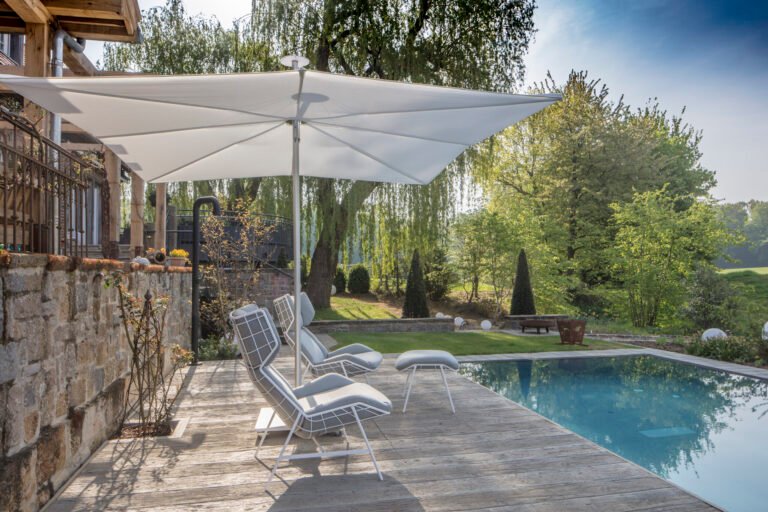 infina center post umbrella garden view